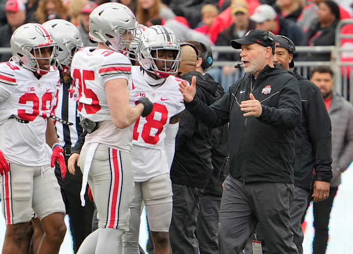 Ohio State defensive coordinator Jim Knowles speaking with some of his defense.